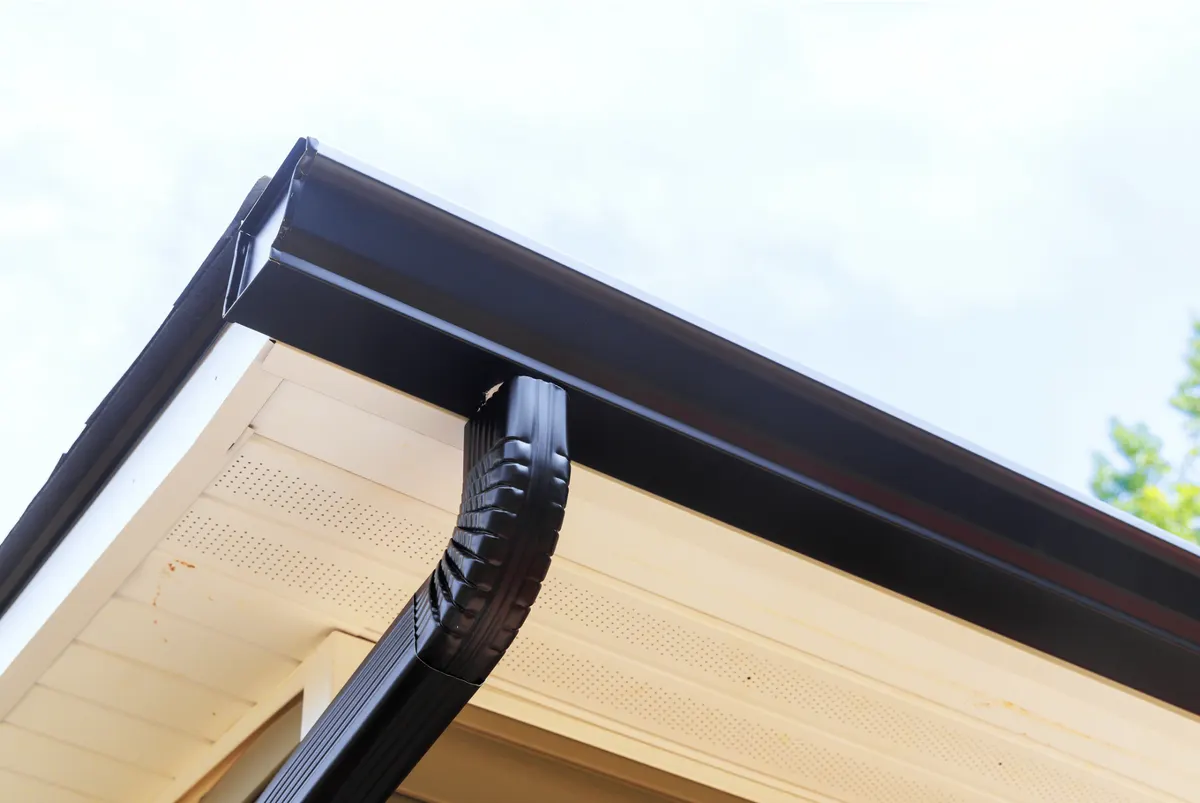 Premium dark seamless gutters on a custom home