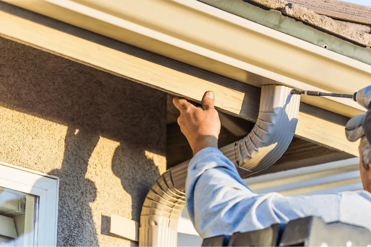 Gutter corner repair on a residential roofline